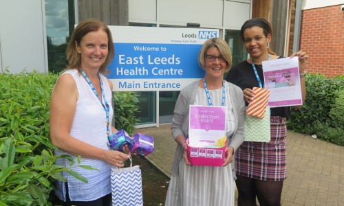 Community nurses standing outside East Leeds Health Centre fundraising to end Period Poverty